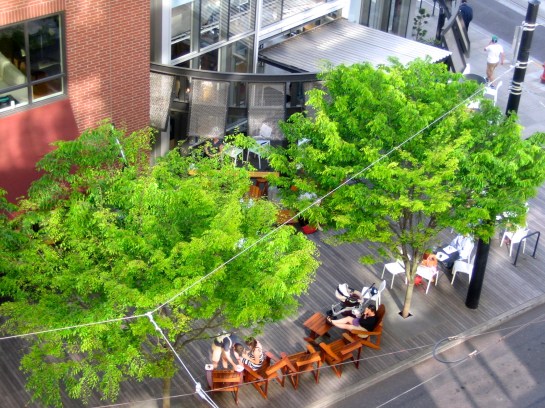 looking down on the bakery from our apartment on a sunny day