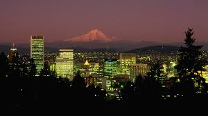 Mt Hood glowing behind a sparkly Portland night